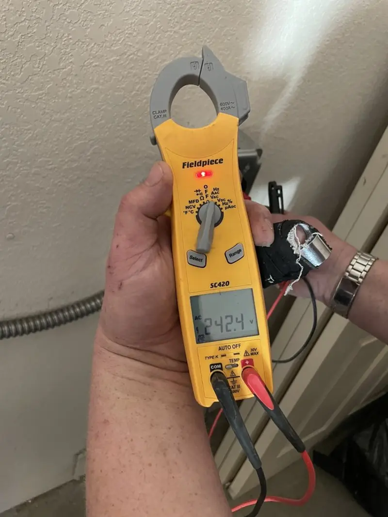 Voltage testing with clamp meter during Outlet Installation in Jourdanton